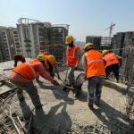 How does lignosulfonate work as a water reducer in concrete?