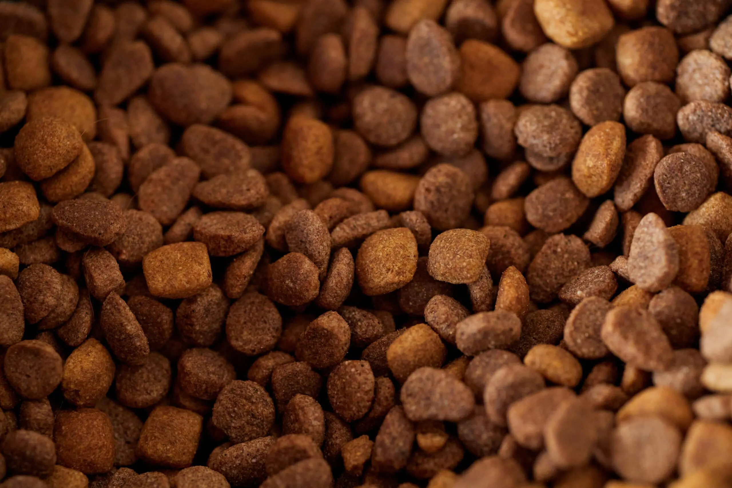 Why is calcium lignosulfonate used in animal feed pellets?